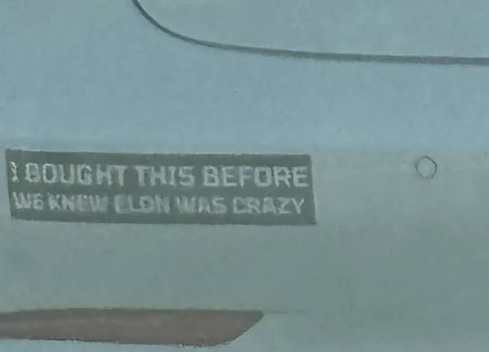 Bumper sticker reads: "I bought this before we knew Elon was crazy."