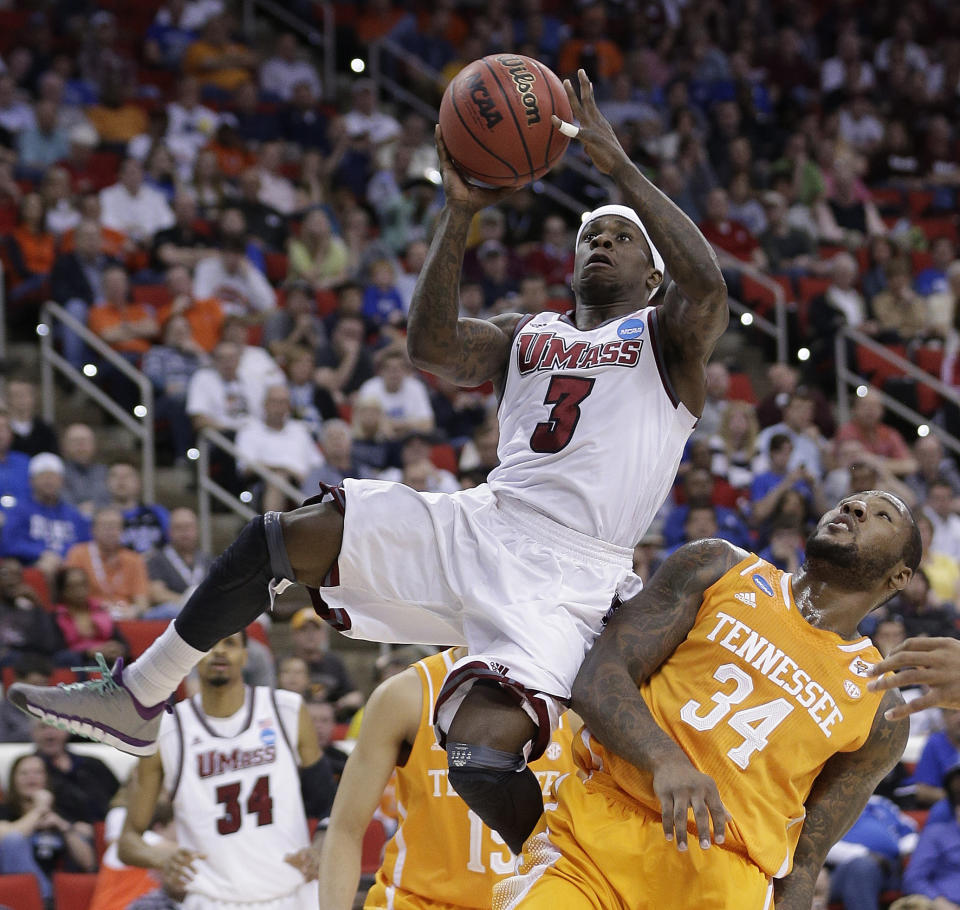 Massachusetts guard Chaz Williams (3) shoots over Tennessee forward Jeronne Maymon (34) during the first half of an NCAA college basketball second-round tournament game, Friday, March 21, 2014, in Raleigh, N.C. (AP Photo/Chuck Burton)