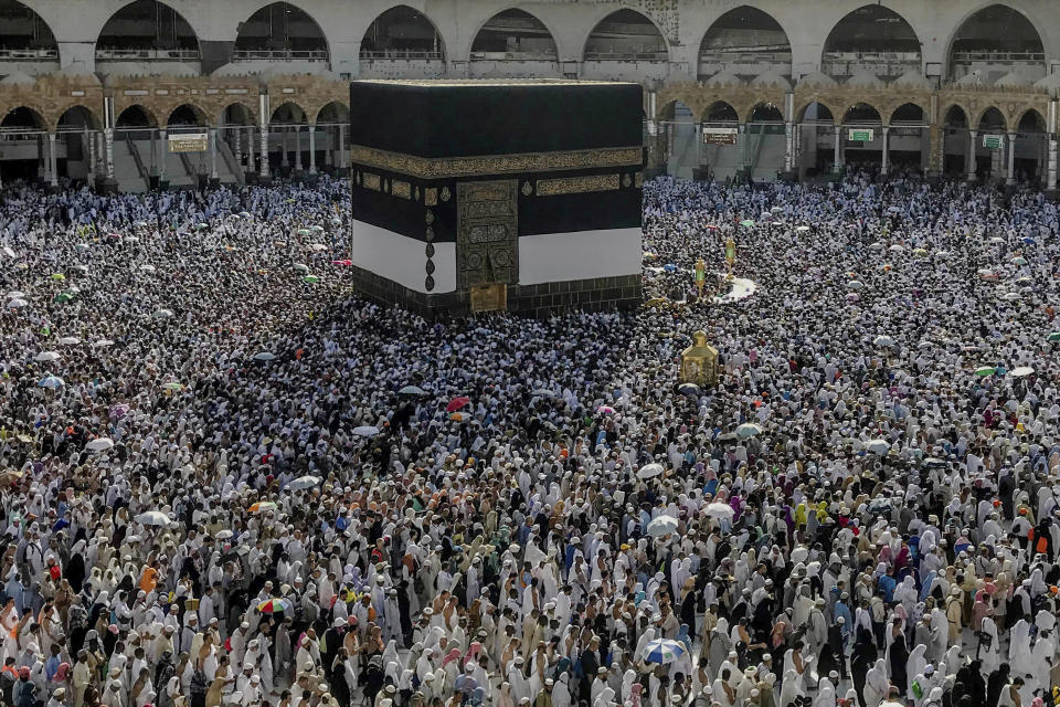 Muslim pilgrims circumambulate around the Kaaba in the Grand Mosque, ahead of the annual Hajj pilgrimage, in the Muslim holy city of Mecca, Saudi Arabia, Friday, Aug. 17, 2018. The annual Islamic pilgrimage draws millions of visitors each year, making it the largest yearly gathering of people in the world. (AP Photo/Dar Yasin)