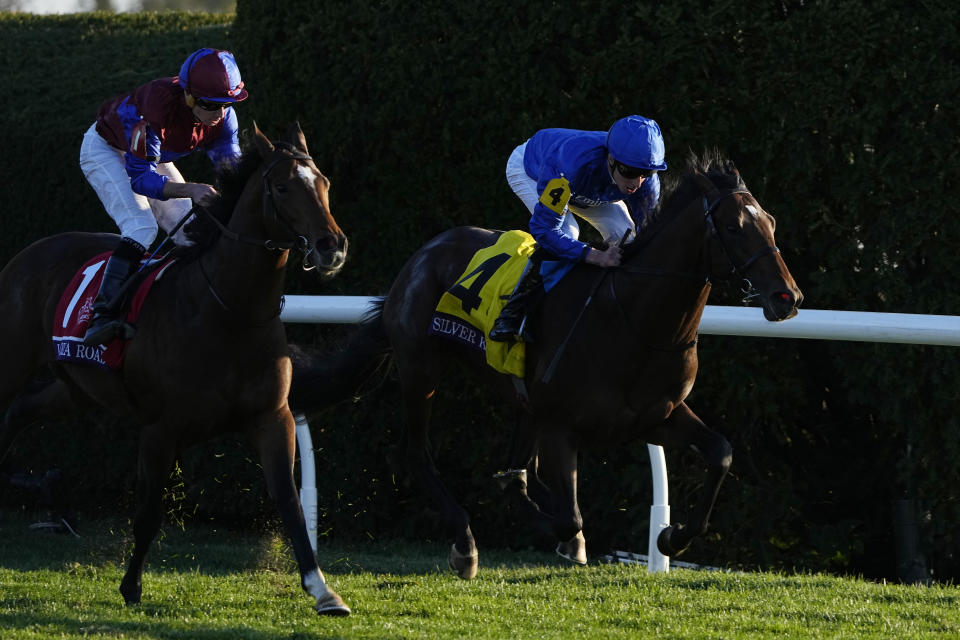 Ryan Moore rides Victoria Road (1) rides past William Buick rides Silver Knott (4) to win the Breeders' Cup Juvenile Turf race at the Keenelend Race Course, Friday, Nov. 4, 2022, in Lexington, Ky. (AP Photo/Darron Cummings)