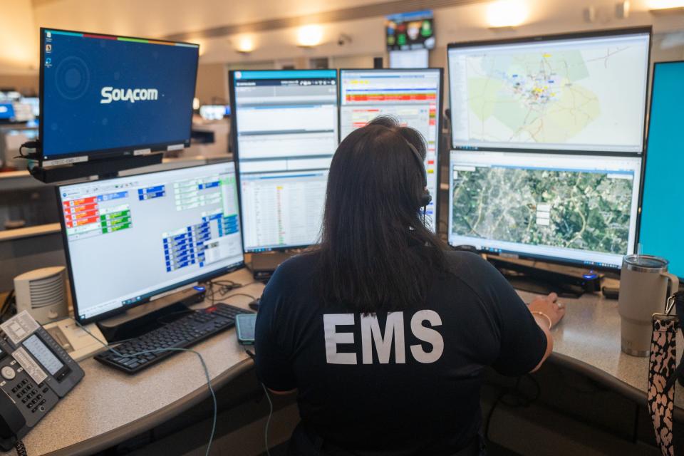 Lindsey Rutledge, communications clinical specialist with Austin Travis-County EMS, takes a call at the Combined Transportation, Emergency and Communications Center (CTECC) Thursday, June 20, 2024.