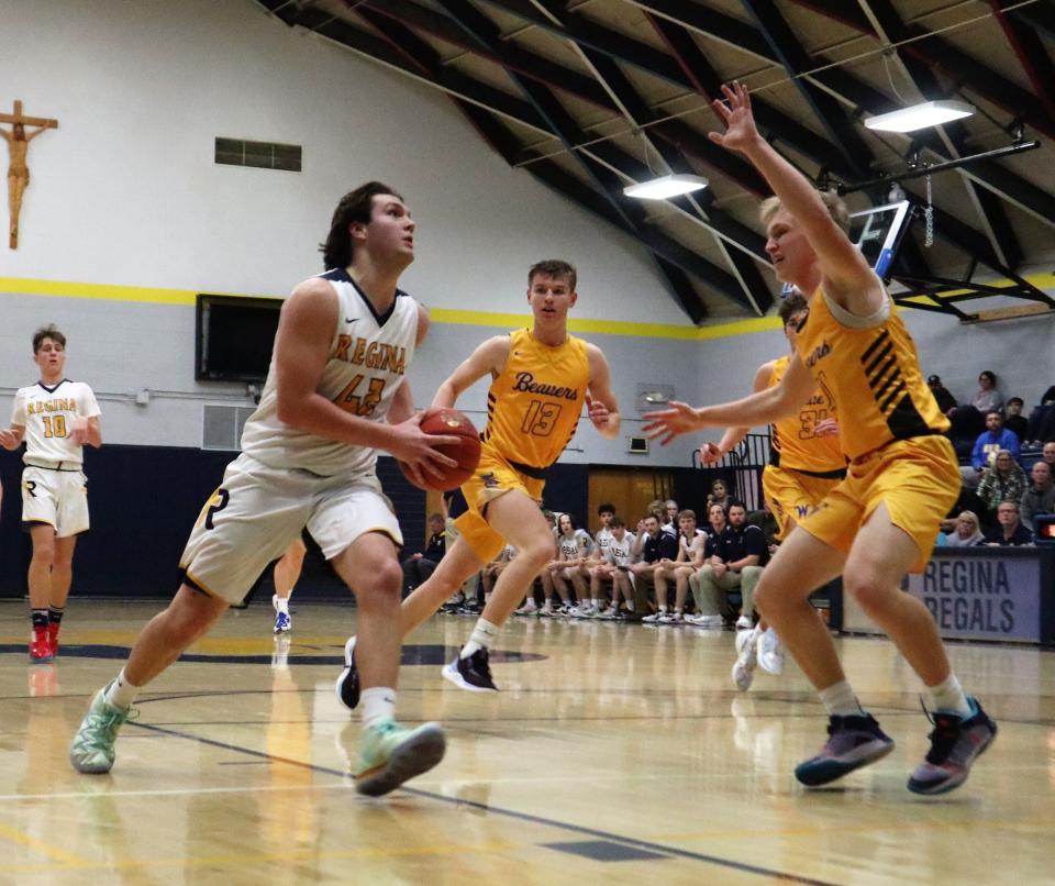 Regina junior forward Drew Streb drives to the hoop against Wilton.