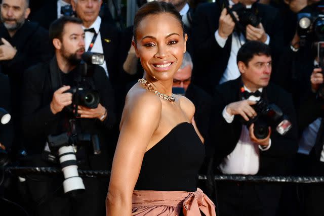 <p>CHRISTOPHE SIMON/AFP via Getty</p> Zoe Saldaña at the 2024 Cannes Film Festival on May 18