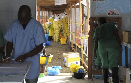 Medicins Sans Frontieres (MSF) health workers prepare at ELWA's hospital isolation camp during the visit of Senior United Nations (U.N.) System Coordinator for Ebola, David Nabarro, in Monrovia August 23, 2014. REUTERS/2Tango