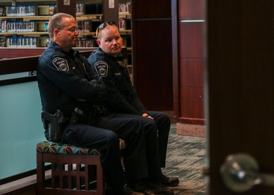 Police wait outside of the West Lafayette Library meeting room as residents hear from Matt Gentry, the City of Lebanon’s Mayor at the Stop the Water Steal grassroots group's meeting, on Tuesday, March 21, 2024, in West Lafayette, Ind.