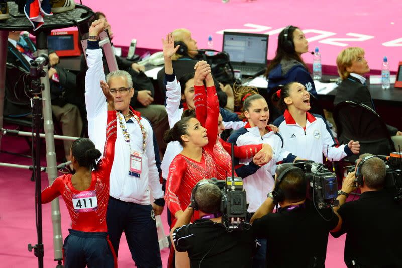 Coach John Geddert reacts after the Olympic women's team gymnastics finals in London