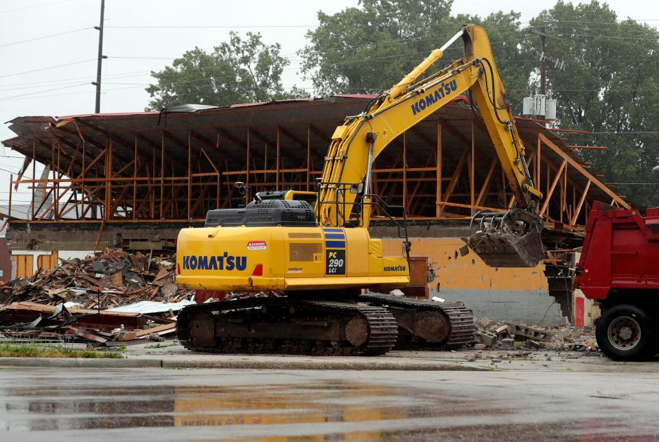 A demolition crew tears down the former Eagles Club on Vanderbraak Street on June 13, 2023, in Green Bay, Wis.