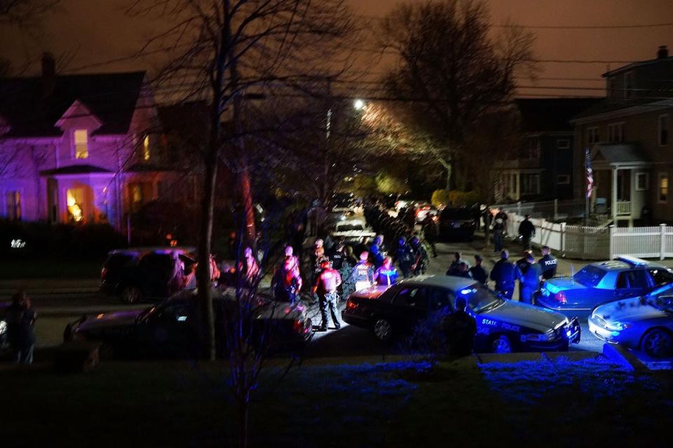 Members of a police SWAT team exit Franklin Street moments after then-suspect Dzhokhar Tsarnaev  was apprehended on 19 April 2013 in Watertown, Massachusetts (Spencer Platt/Getty Images)