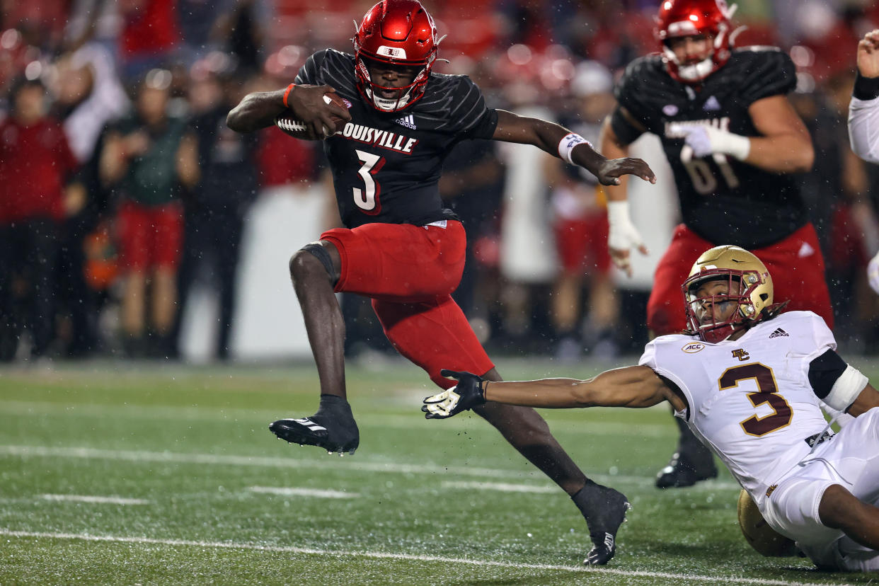 Louisville Cardinals quarterback Malik Cunningham (3) eludes a Boston College defender during a game on Oct. 23, 2021. (Frank Jansky/Icon Sportswire via Getty Images)