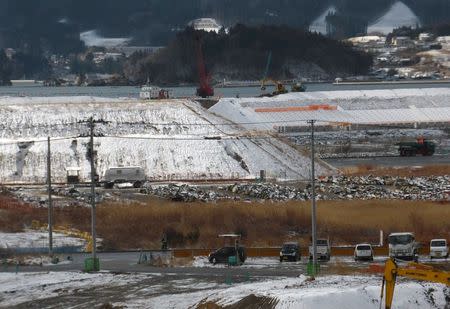 A construction site to raise the ground to protect against tsunami is seen at the coastal area in Rikuzentakata, Iwate prefecture, Japan, March 2, 2016, ahead of the five-year anniversary of the March 11, 2011 earthquake and tsunami disaster. REUTERS/Elaine Lies