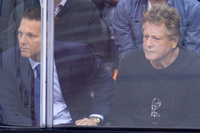 <p>Noel Vasquez/Getty </p> Ryan pictured with son Patrick at an NHL playoff game in 2013