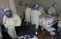 Medical personnel treat a COVID-19 patient at DHR Health, Wednesday, July 29, 2020, in McAllen, Texas. (AP Photo/Eric Gay)