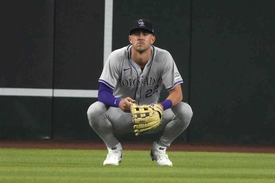 Colorado Rockies right fielder Nolan Jones reacts after dropping a fly ball hit by Arizona Diamondbacks' Ketel Marte during the fifth inning of a baseball game Sunday, March 31, 2024, in Phoenix. (AP Photo/Rick Scuteri)