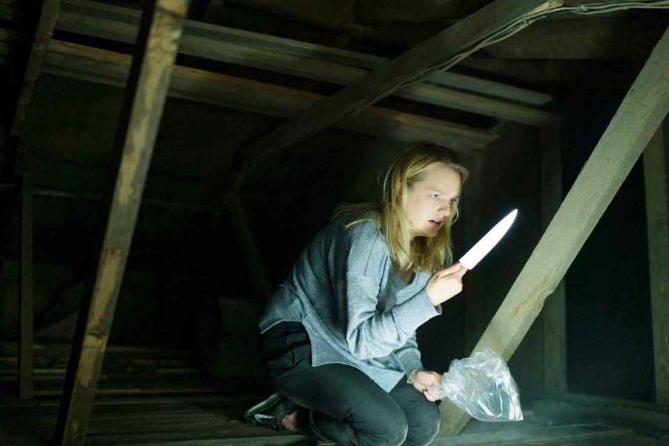 Elisabeth Moss in an attic with a knife