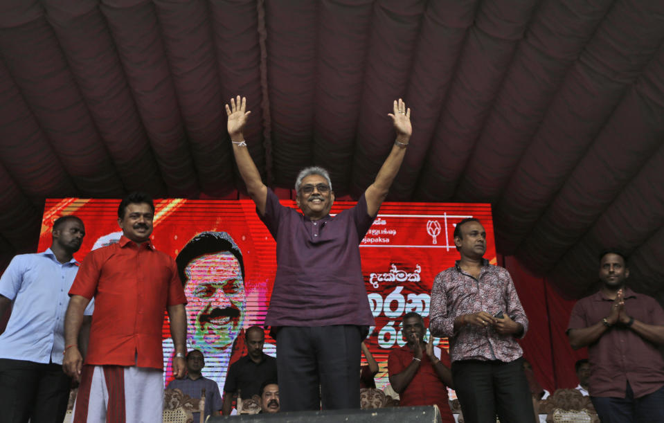 Sri Lankan presidential candidate and former defense chief Gotabaya Rajapaksa waves to supporters at an election rally in Neluwa village in Galle, Sri Lanka, Tuesday, Oct. 22, 2019. The daughter of a Sri Lankan journalist assassinated during the country's civil war says she'll appeal a U.S. court's decision to throw out her lawsuit against Rajapaksa, the front-runner in Sri Lanka's upcoming presidential election. Rajapaksa was defense chief when Lasantha Wickrematunge, editor of the Sunday Leader newspaper, was killed in January 2009, around four months before the end of the long civil war. (AP Photo/Eranga Jayawardena)