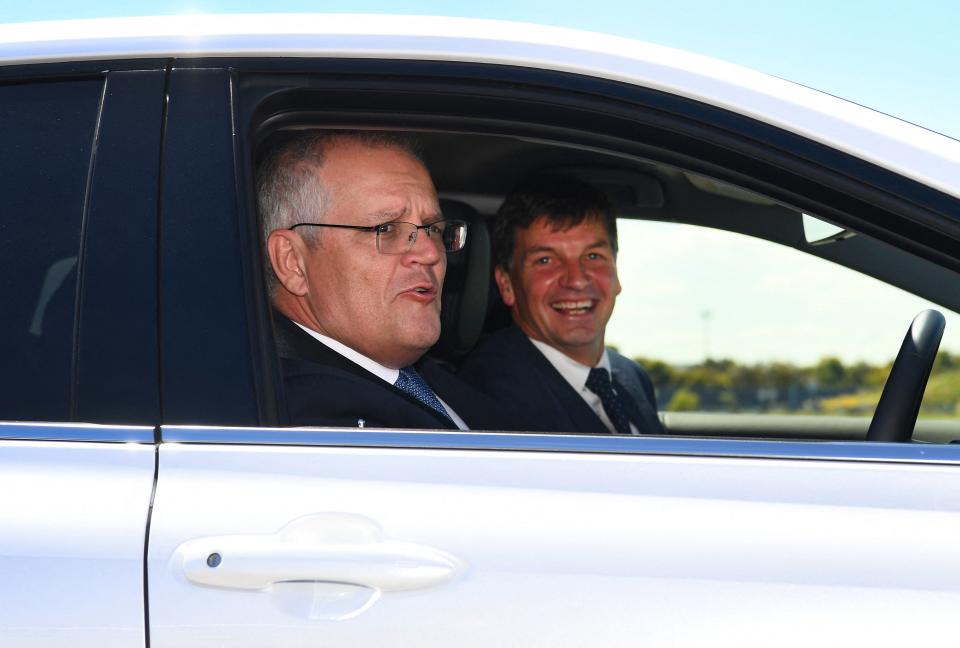 Scott Morrison, left, and Angus Taylor in a car
