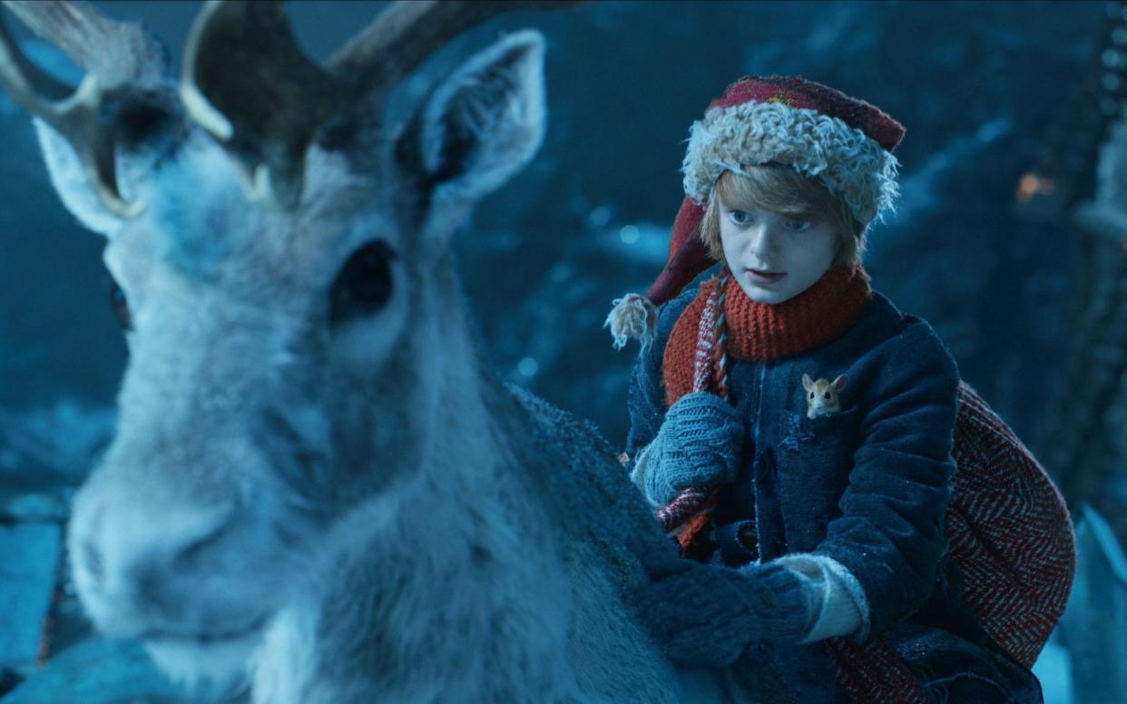 Henry Lawfull stars as Nikolas, a Finnish boy who discovers a flying reindeer and a hidden village of elves - Alamy