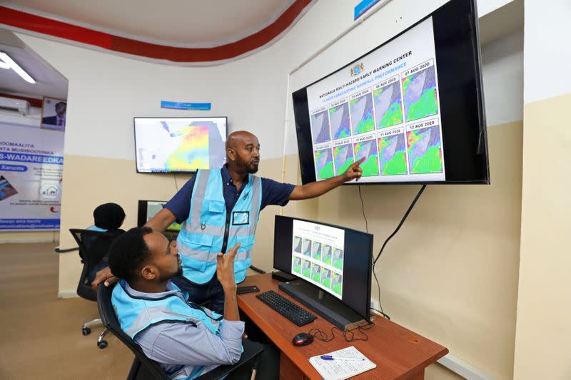 Khadar Sheikh Mohamed director of the new national disaster early warning centre designed to help Somalia predict disasters monitors the weather patterns, in Mogadishu