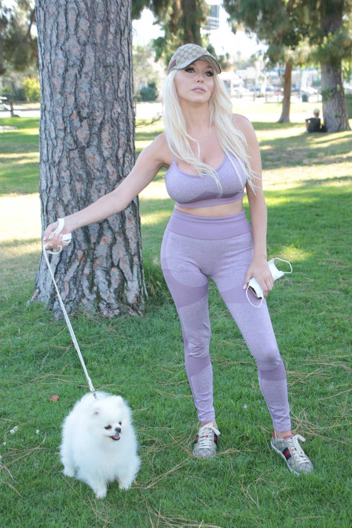 Courtney in a park with their dog