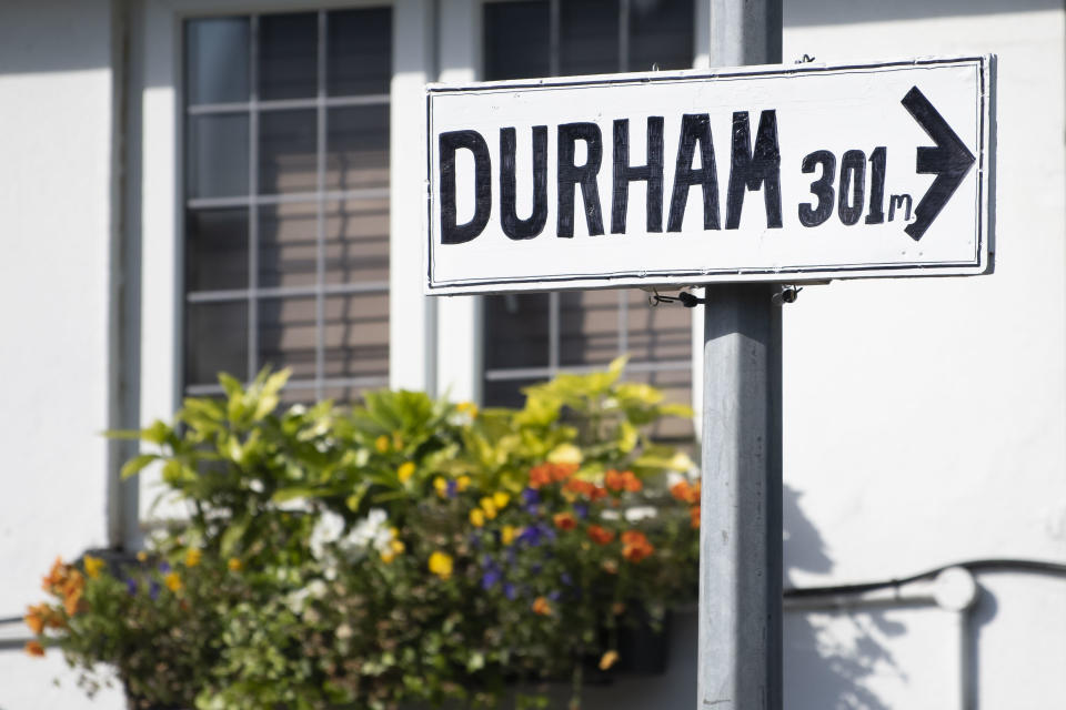 CARDIFF, UNITED KINGDOM - MAY 27: A sign giving directions to Durham outside the Maltsters pub on May 27, 2020 in Cardiff, United Kingdom. British Prime Boris Johnson will today be questioned by senior MPs amid calls for his chief advisor Dominic Cummings to resign after he made a controversial lockdown trip to Durham.The British government continues to ease the coronavirus lockdown by announcing schools will open to reception year pupils plus years one and six from June 1st. Open-air markets and car showrooms can also open from the same date. (Photo by Matthew Horwood/Getty Images)