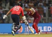 Cricket - West Indies v England - World Twenty20 cricket tournament - Mumbai, India, 16/03/2016. West Indies wicketkeeper Denesh Ramdin (R) runs out England's Moeen Ali. REUTERS/Danish Siddiqui