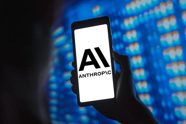 The Anthropic logo is displayed on a smartphone screen.