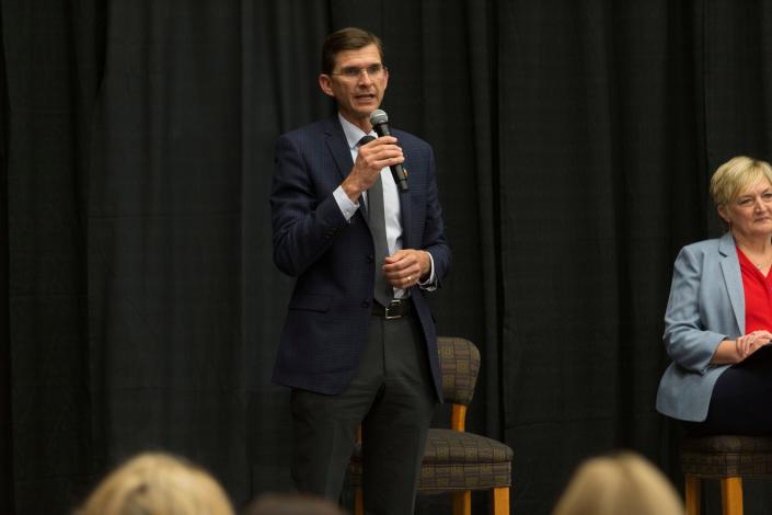 Neil Walter, a candidate vying for a spot in the Utah Legislature, speaks as his opponent Kristy Pike looks on during a debate hosted by the Washington County Republican Party for local candidates ahead of the upcoming primary election. The debates were held at the Dixie Convention Center in St. George on Tuesday, May 17, 2022.