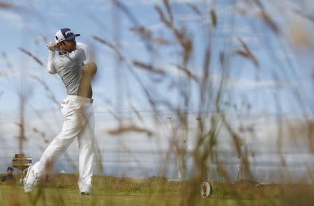 Louis Oosthuizen of South Africa hits his tee shot on the 15th hole during the third round of the British Open golf championship on the Old Course in St. Andrews, Scotland, July 19, 2015. REUTERS/Lee Smith