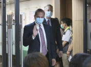 U.S. Health and Human Services Secretary Alex Azar waves to press before the signing ceremony for a memorandum of understanding at the Central Epidemic Command Center in Taipei, Taiwan, Monday, Aug. 10, 2020. Azar arrived in Taiwan on Sunday in the highest-level visit by an American Cabinet official since the break in formal diplomatic relations between Washington and Taipei in 1979. (AP Photo/Chiang Ying-ying)