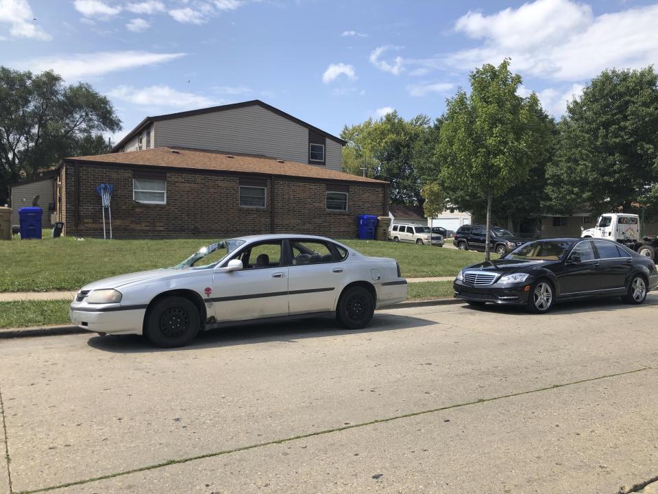 Vehicles are parked Friday, Aug. 28, 2020, in Kenosha, Wis., where Jacob Blake, a Black man, was shot by police on Aug. 23. The city and its surrounding county remained under a curfew amid protest in the city. (AP Photo/ Russell Contreras)