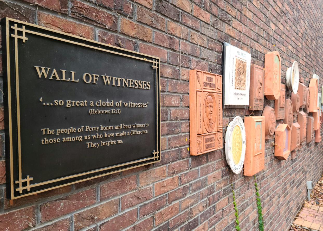 The Wall of Witnesses in Soumas Court showcases influential Perry residents.