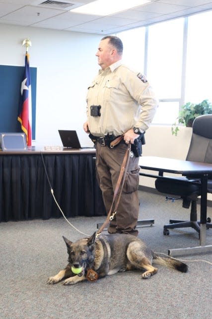 K-9 Mercy and her handler, Deputy Kevin Waddle, await accolades from Taylor County Commissioners. Mercy is retiring after five years of service.