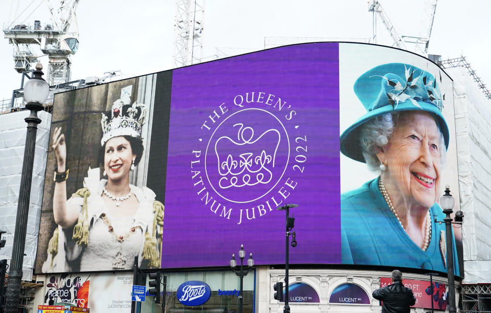 <p>Images of Queen Elizabeth II are displayed on the lights in London's Piccadilly Circus to mark her Platinum Jubilee, on 6 February 2022 – 70 years to the day since she acceded to the throne on her father's death. (PA)</p> 
