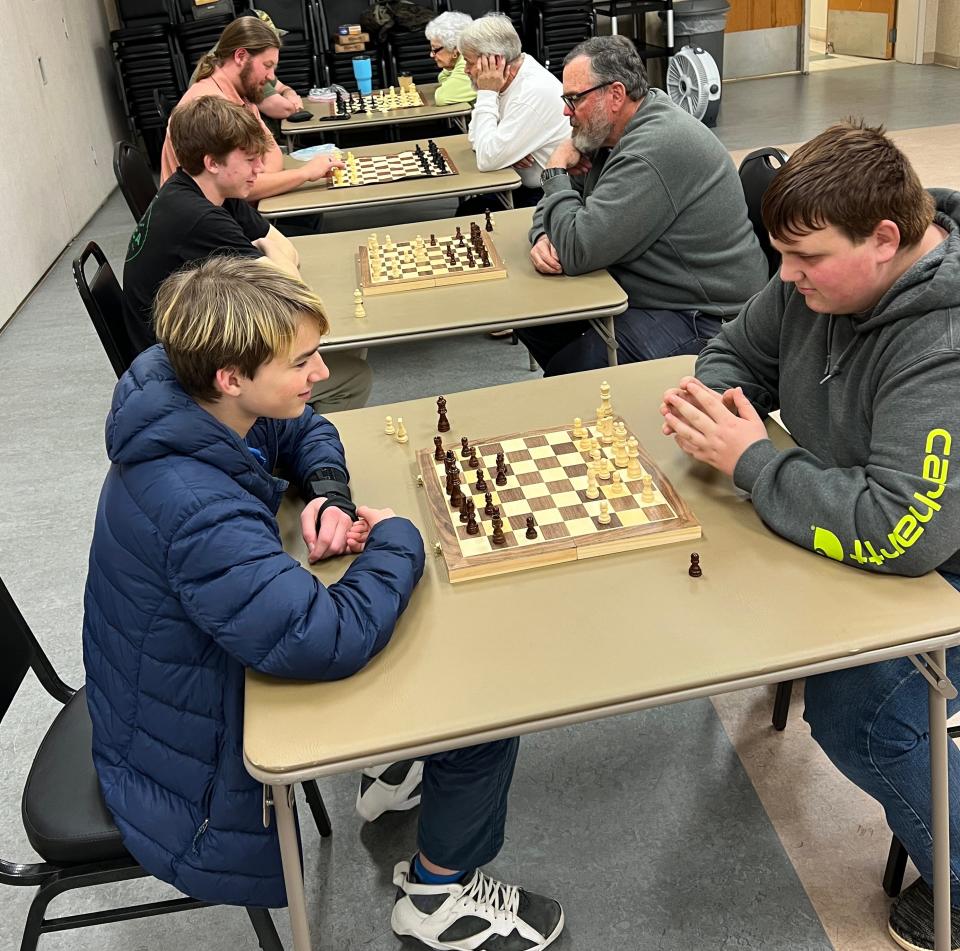 Murphy Stiles, left, and Jeremiah McSwain compete in the first table and Ray McSwain, right, is playing Ramsey Stiles in the second table at a recent meeting of Gaston Chess. The club meets 6:30 p.m. Tuesdays at the Gaston Senior Center, 1303 Dallas Cherryville Highway, Dallas.