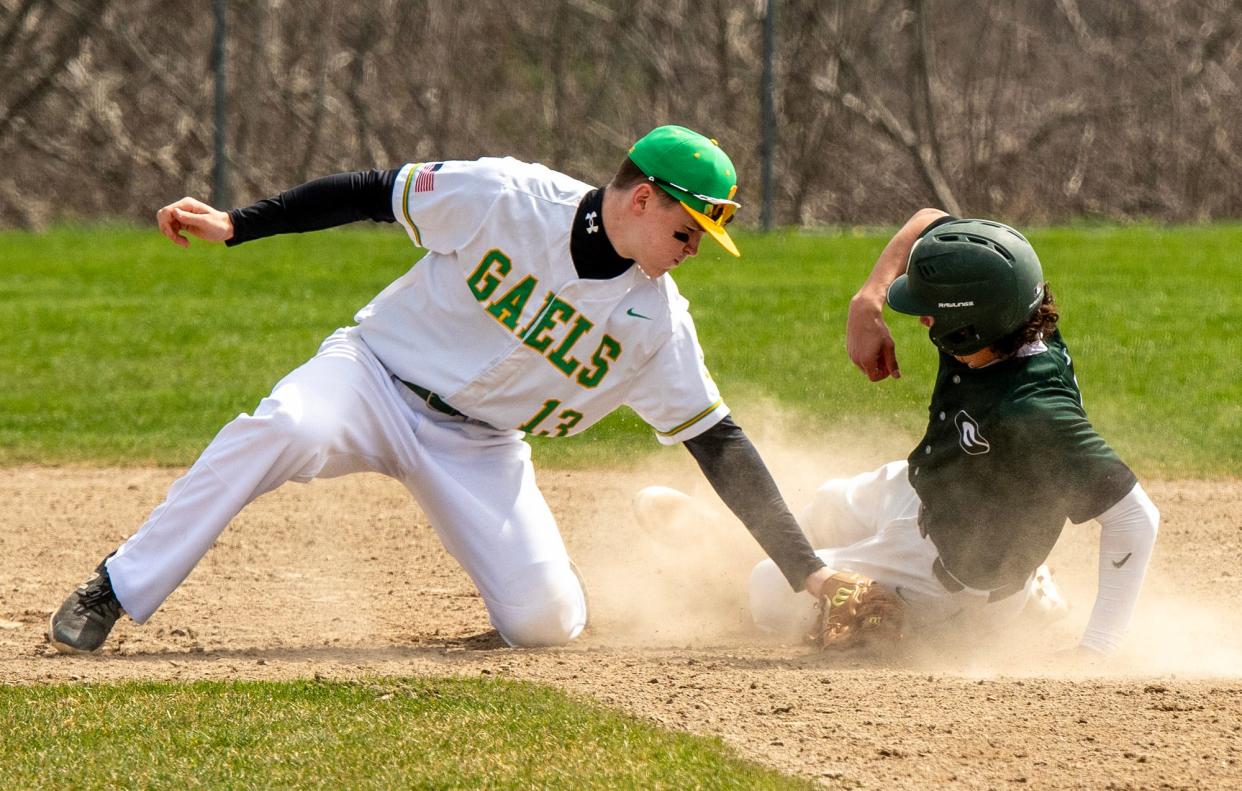 Grafton’s AJ Parlante safely steals second base under the tag from Clinton’s Liam Nelligan in the first inning Friday.