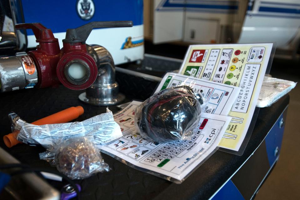 A sensory kit created and sent to local fire stations to use when communicating with individuals who are on the autism spectrum sits on a fire truck for display at Horsham Fire Company station on Meetinghouse Road on Wednesday, Feb. 16, 2022. 