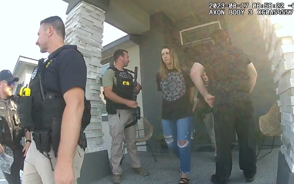 In this video image from an officer's body camera, Shanna Gardner is escorted out of her West Richland, Wash., home for her Aug. 17 arrest in her ex-husband Jared Bridegan's murder plot in Jacksonville Beach.