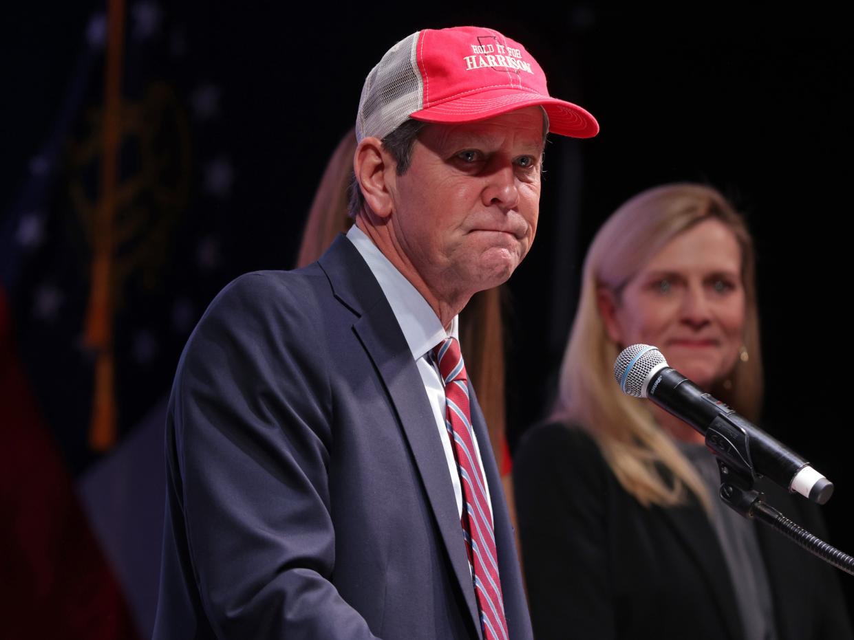 <p>Georgia Gov. Brian Kemp speaks as his wife Marty Kemp looks on during a run-off election night party at Grand Hyatt Hotel in Buckhead on 5 January 2021 in Atlanta, Georgia</p> ((Getty Images))