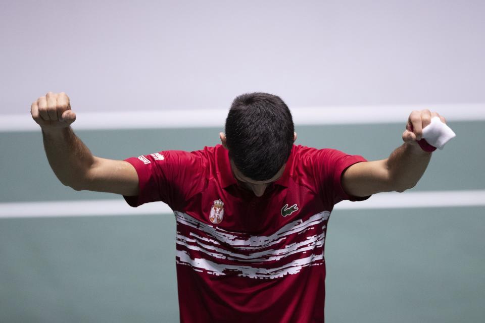 Serbia's Novak Djokovic celebrates after winning Japan's Yoshihito Nishioka during their Davis Cup tennis match in Madrid, Spain, Wednesday, Nov. 20, 2019. (AP Photo/Bernat Armangue)