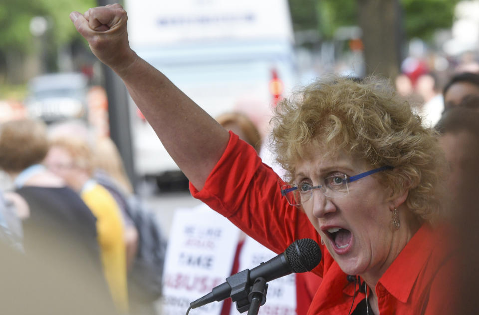FILE - In this Tuesday, June 11, 2019 file photo, Christa Brown, of Denver, Colo., speaks during a rally in Birmingham, Ala., outside the Southern Baptist Convention's annual meeting. Brown, an author and retired attorney, says she was abused by a Southern Baptist minister as a child. She has been pushing the SBC to create an independently run database listing pastors and other church personnel who have been credibly accused of abuse. (AP Photo/Julie Bennett)