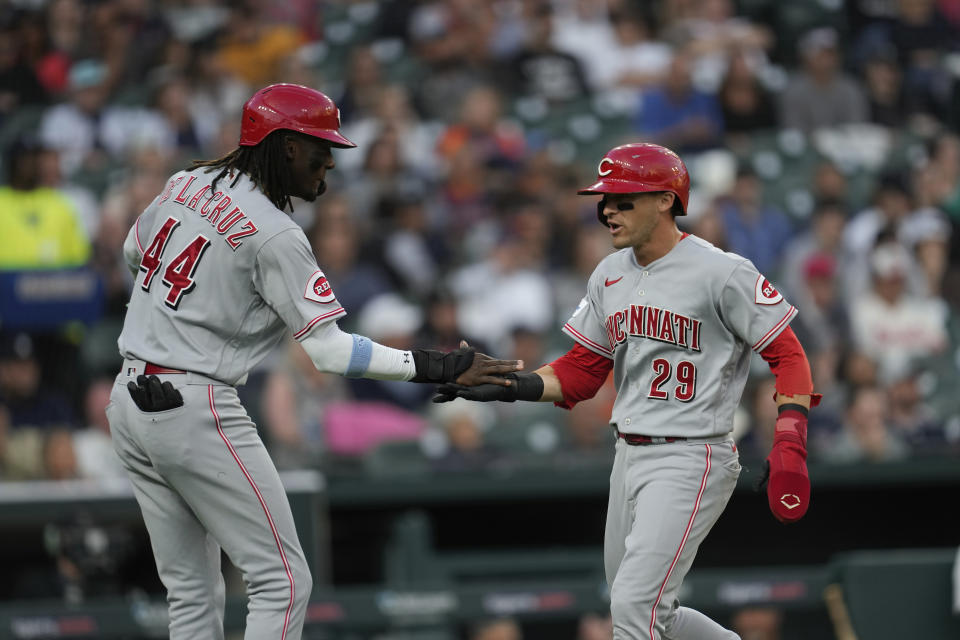 Cincinnati Reds' Elly De La Cruz (44) and TJ Friedl (29) celebrate scoring against the Detroit Tigers in the second inning of a baseball game, Tuesday, Sept. 12, 2023, in Detroit. (AP Photo/Paul Sancya)