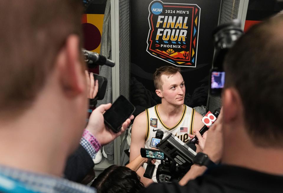 Purdue Boilermakers guard Fletcher Loyer (2) answers questions in the locker room Saturday, April 6, 2024, after the NCAA Men’s Basketball Tournament Final Four game against the North Carolina Wolfpack on Saturday, April 6, 2024, at State Farm Stadium in Glendale, Ariz.