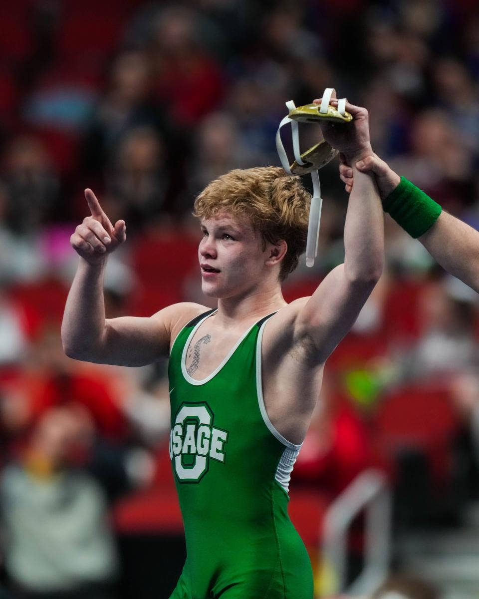 Osage’s Anders Kittelson gets his hand raised after defeating Glenwood’s Matt Beem at 132 pounds during the semifinals of the Class 2A of the Iowa high school state wrestling tournament at Wells Fargo Arena in Des Moines on Friday, Feb. 17, 2023.