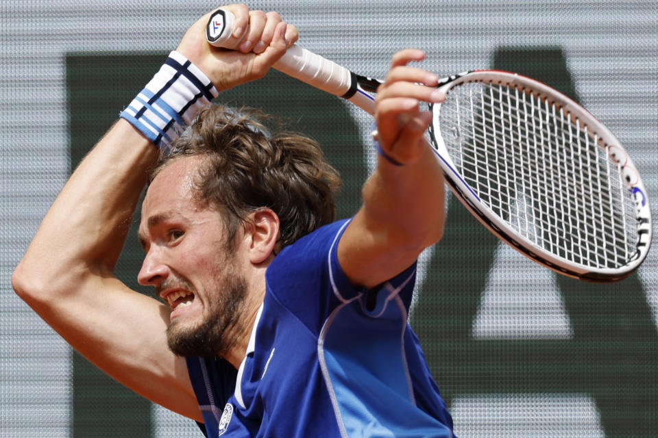 FILE - Russia's Daniil Medvedev plays a shot against Serbia's Laslo Djere during their second round match at the French Open tennis tournament in Roland Garros stadium in Paris, France, Thursday, May 26, 2022. Medvedev will compete in the U.S. Open tennis tournament that begins Monday. (AP Photo/Jean-Francois Badias)