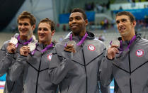 <b>Medal No. 17: </b>From left to right, Adrian Nathan, Ryan Lochte, Cullen Jones and Michael Phelps pose with the silver medals won during the Men's 4 x 100m Freestyle Relay final on Day 2 of the London 2012 Olympic Games.