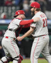 Cincinnati Reds starting pitcher Wade Miley, right, is congratulated by catcher Tucker Barnhart after pitching a no-hitter against the Cleveland Indians in a baseball game, Friday, May 7, 2021, in Cleveland. (AP Photo/Tony Dejak)