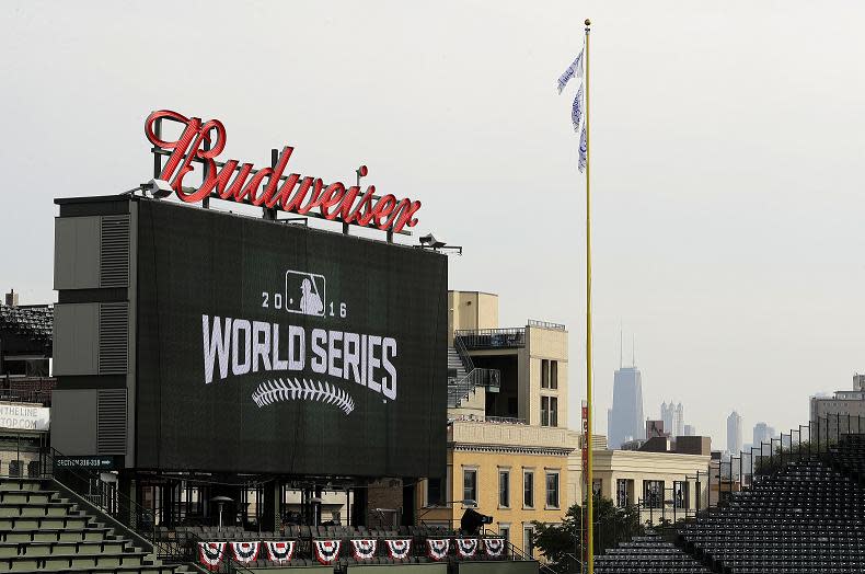 Downtown skyline is seen behind the scoreboard at Wrigley Field before Game 3 of the World Series. (AP)