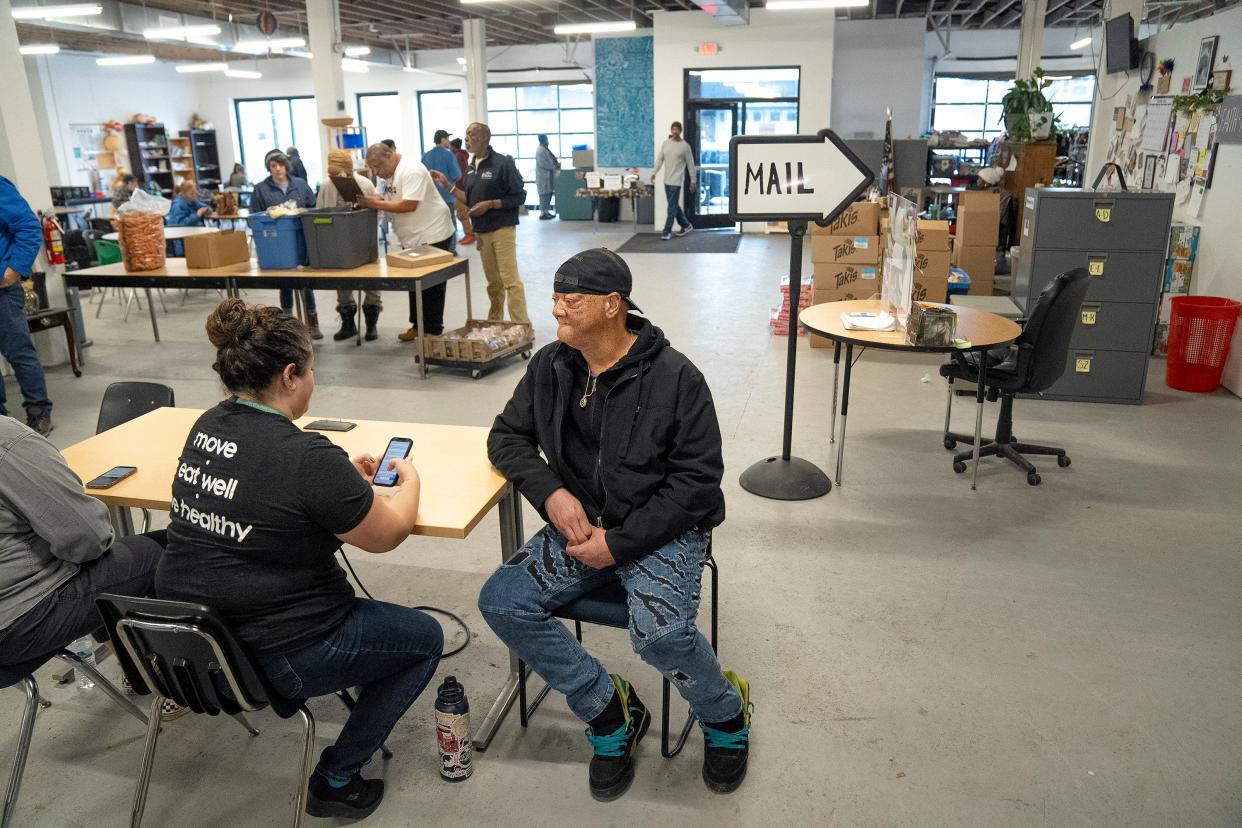 Tyrone Fultz, right, speaks with volunteer Julia Borland on Thursday, Jan. 25, 2024, at The Open Shelter on Parsons Avenue in Columbus during the Community Shelter Board's annual "point-in-time" homeless count done every January. Fultz is currently unhoused.