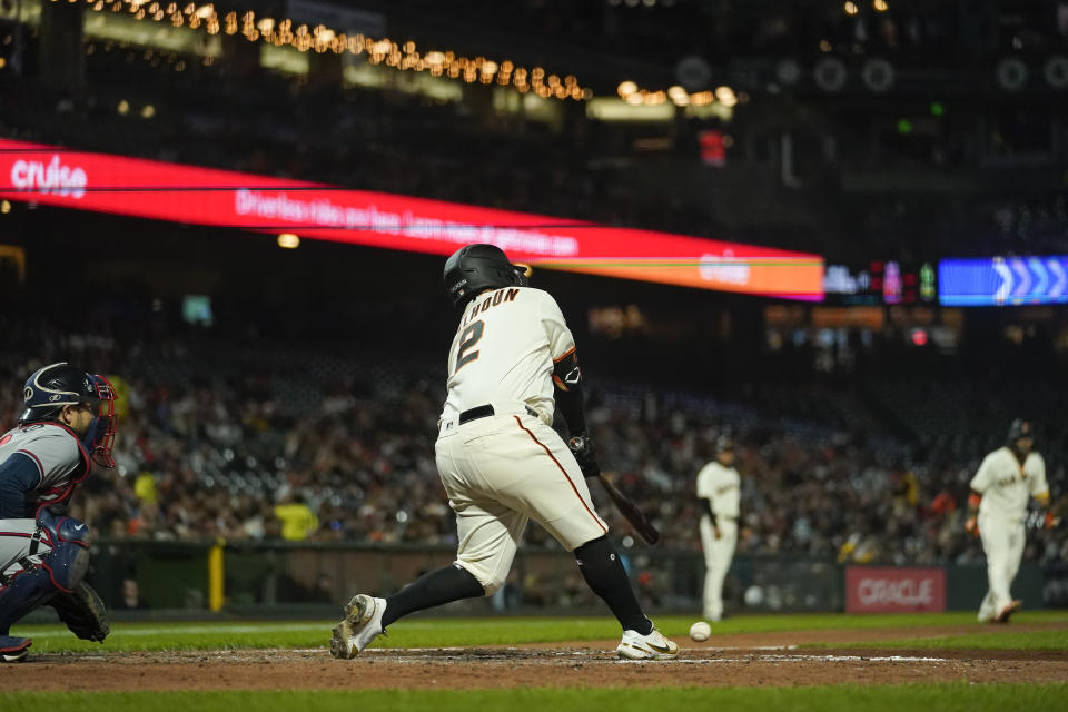 San Francisco Giants' Willie Calhoun (2) strikes out against the Atlanta Braves to end the fifth inning of a baseball game in San Francisco, Monday, Sept. 12, 2022. (AP Photo/Godofredo A. Vásquez)