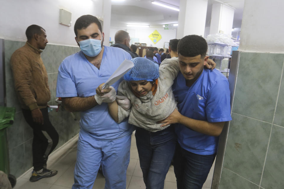 Palestinians wounded in the Israeli bombardment of the Gaza Strip arrive at a hospital in Rafah, on Wednesday, Dec. 6, 2023. (AP Photo/Hatem Ali)